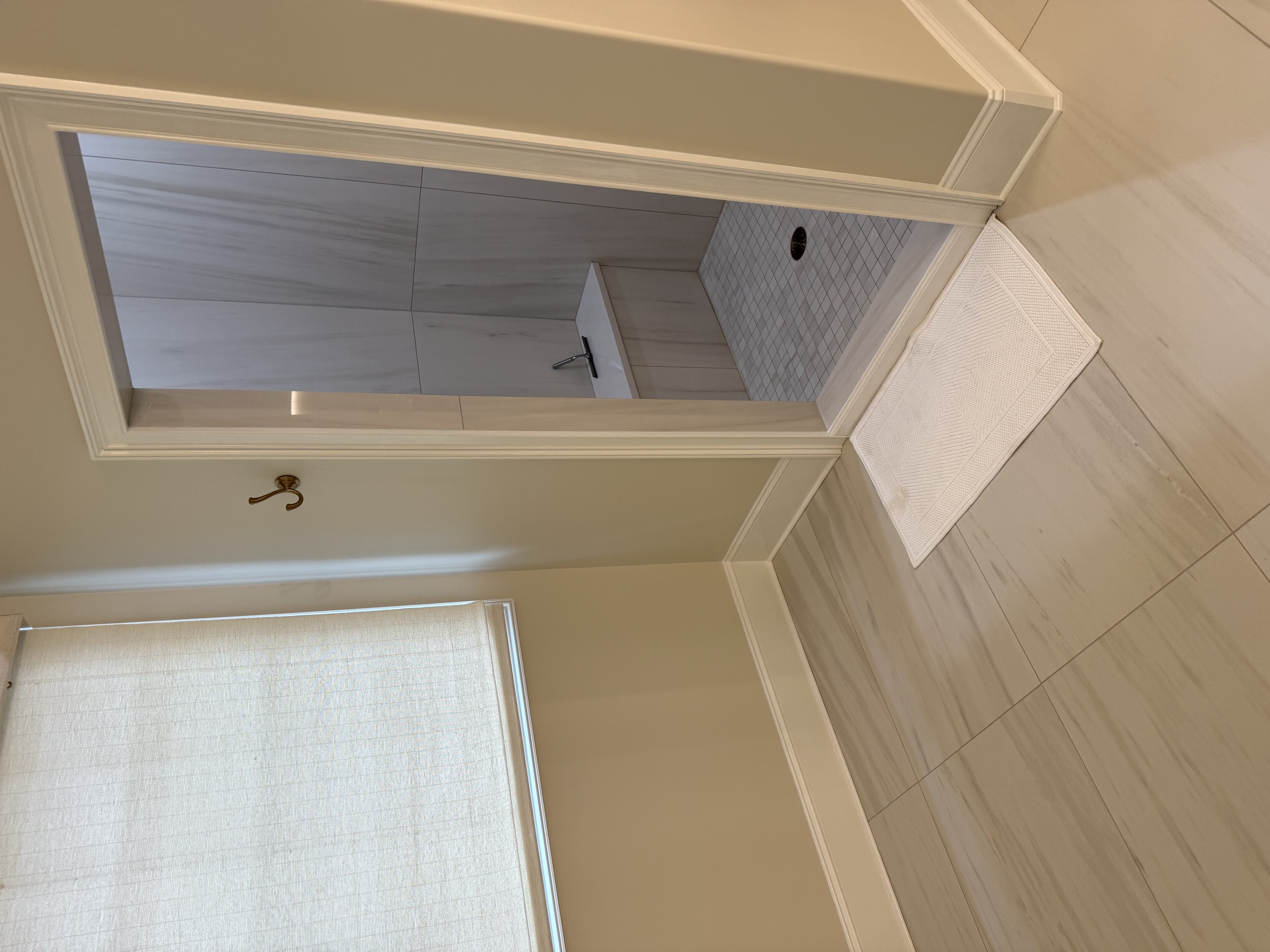 Five Forks master bathroom before remodel — wide view of dark cherry vanity and corner jacuzzi in Simpsonville SC